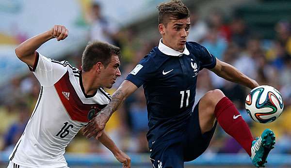 Antoine Griezmann (r.) und Philipp Lahm können künftig Teamkollegen werden