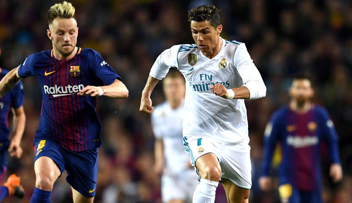 Ivan Rakitic (l.) und Cristiano Ronaldo spielten lange Jahre bei den Erzrivalen Real Madrid und Barcelona gegeneinander.