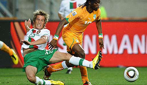 Fabio Coentrao (l. gegen Gervinho) stand bisher in allen WM-Spielen der Portugiesen in der Startelf