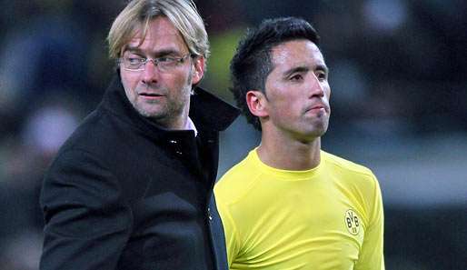BVB-Trainer Jürgen Klopp (l.) sieht eher schwarz für Lucas Barrios' Einsatz gegen Leverkusen