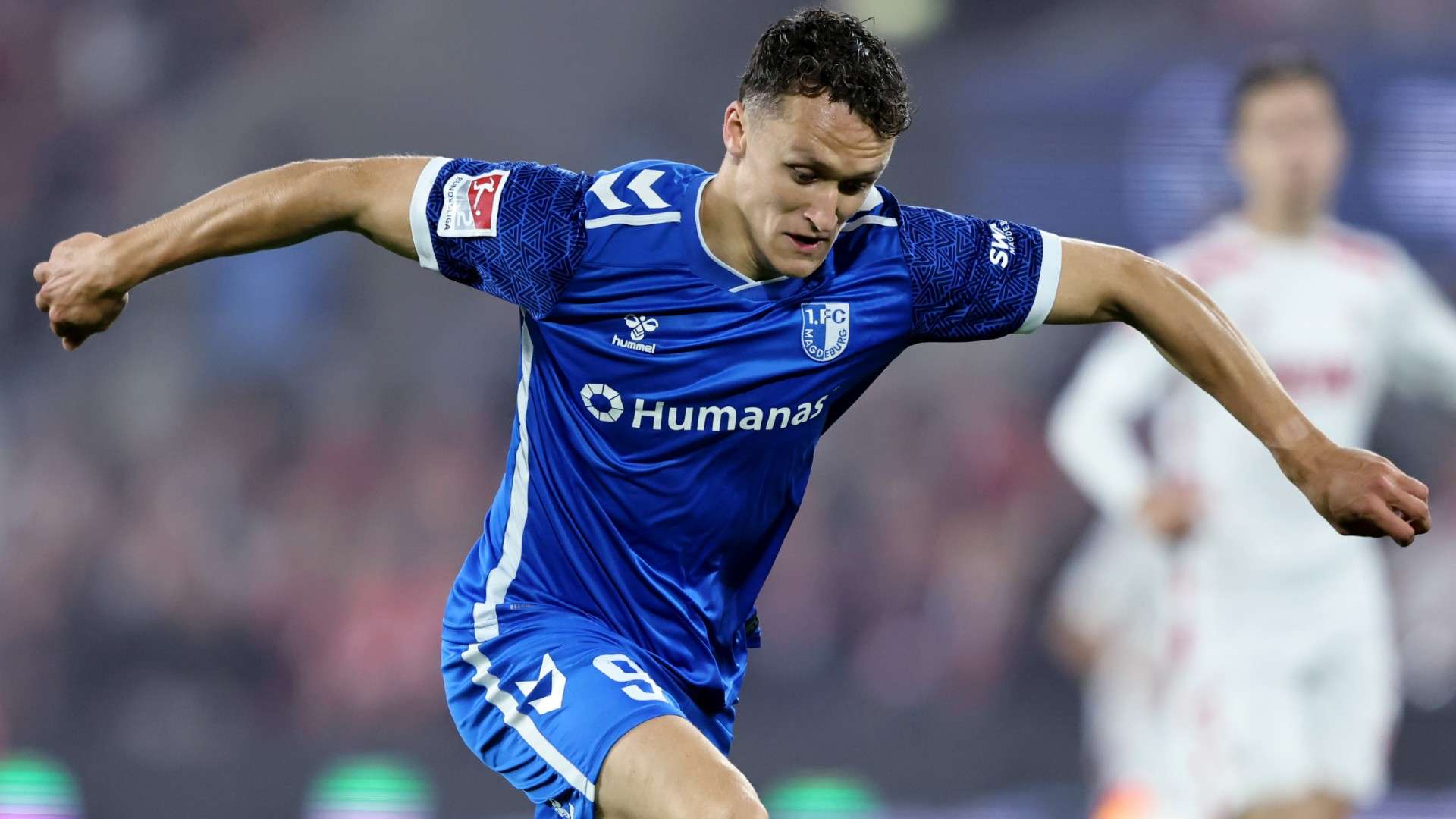 Martijn Kaars of 1. FC Magdeburg runs with the ball