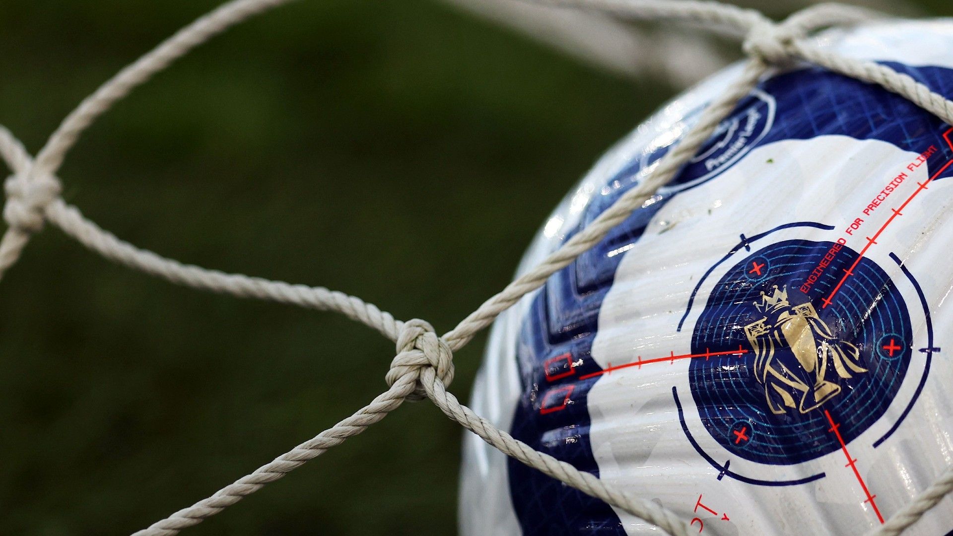 A Premier League trophy logo is seen on a matchball ahead of the English Premier League football