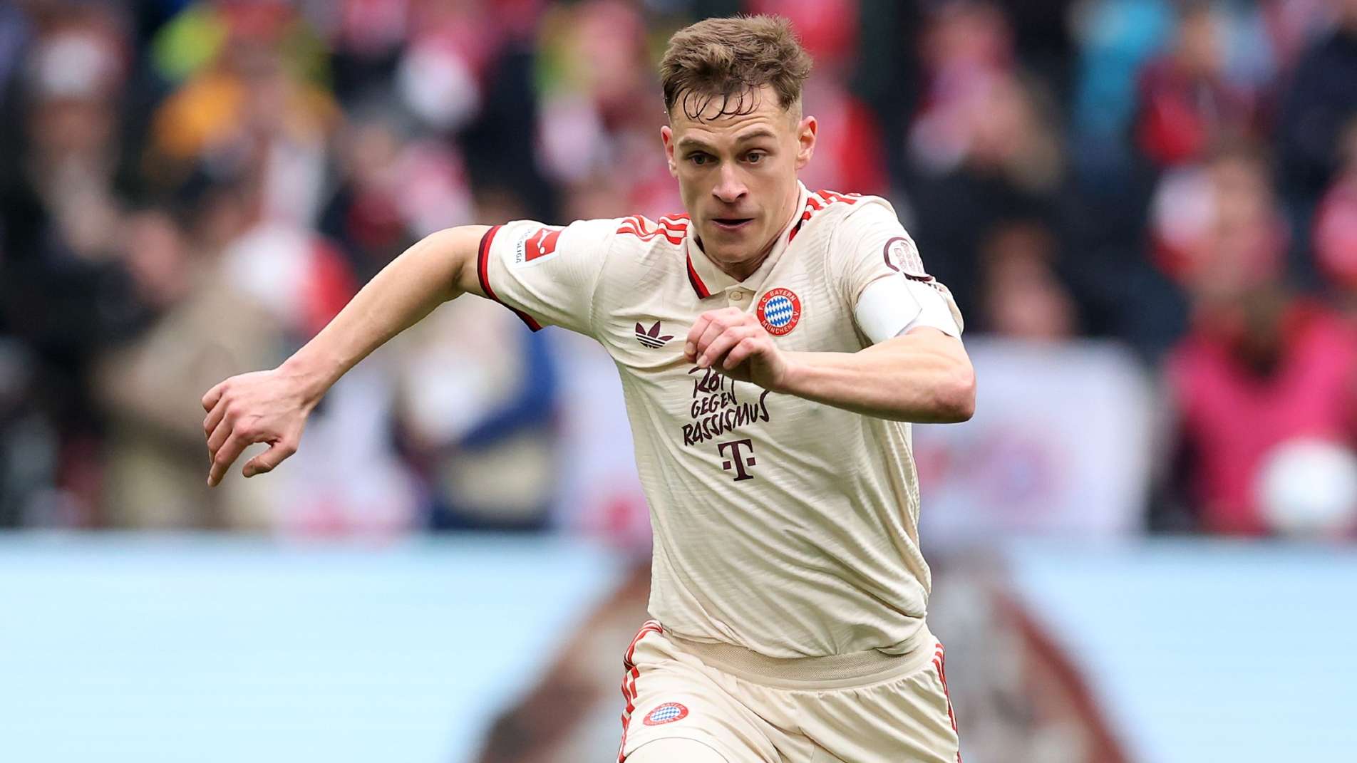 Joshua Kimmich of FC Bayern München runs with the ball