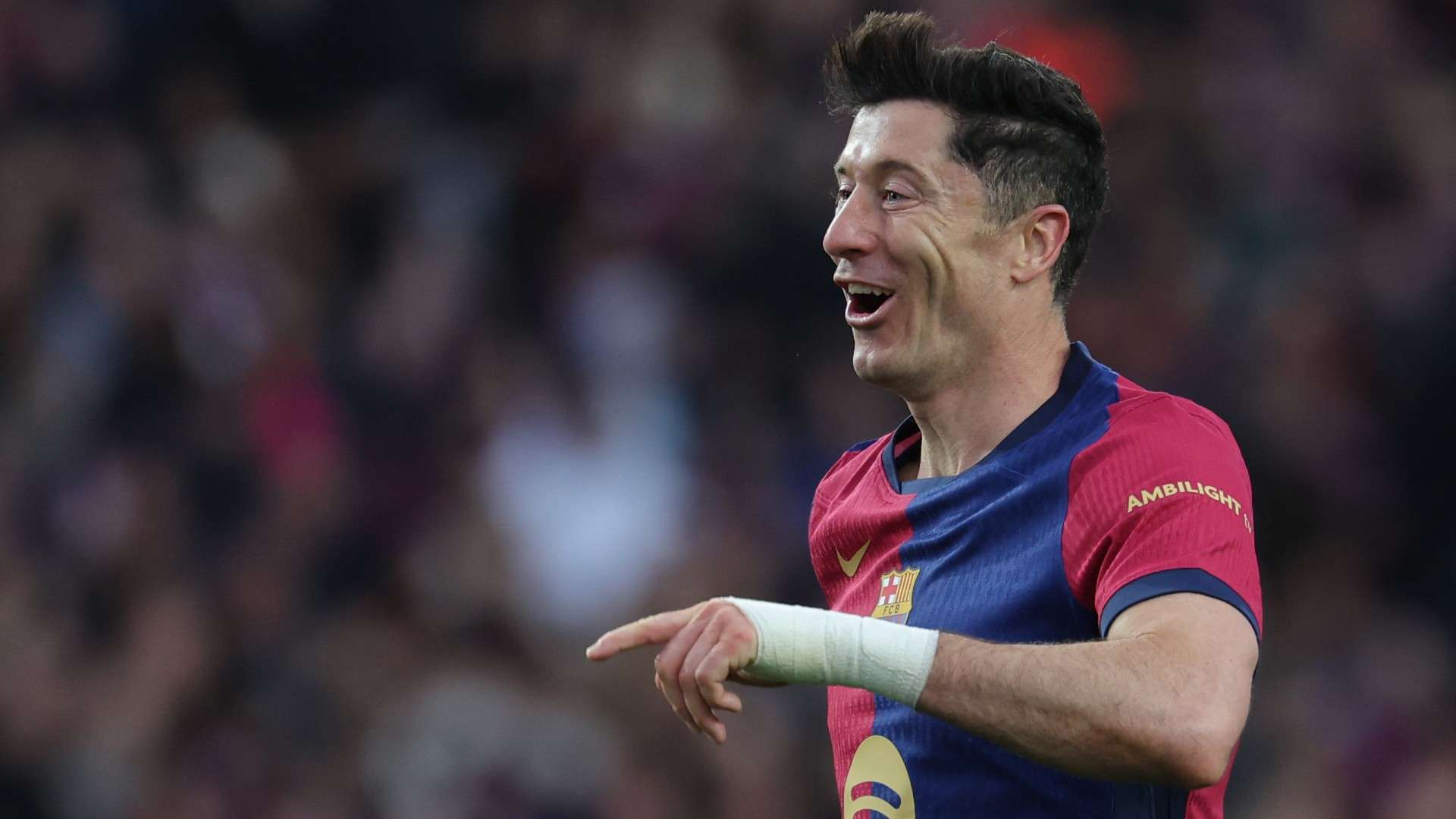 Barcelona's Polish forward #09 Robert Lewandowski celebrates scoring 