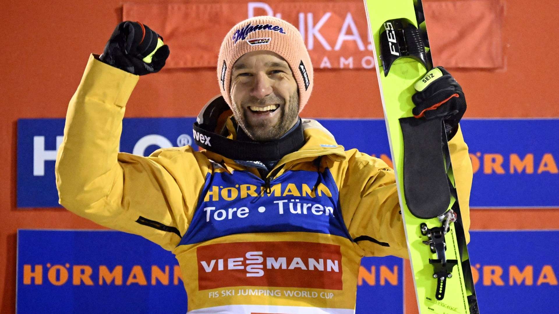 Winner Germany's Pius Paschke celebrates on the podium